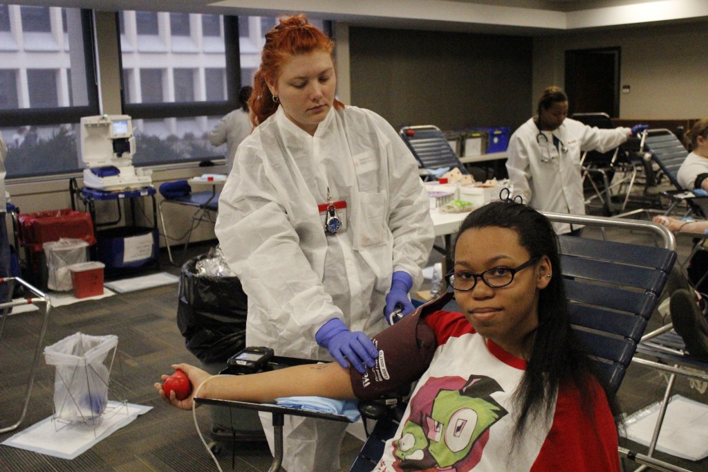 Brittany Shafer (left) draws Malei Barry’s blood (right) for the American Red Cross. Students thinking about donating in the future, make sure to use these tips from the American Red Cross. Drink plenty of water while staying away from alcohol and caffeinated beverages to make sure you are well hydrated. Eat a diet high in iron-rich foods. PHOTO | CORY MUEHLEBACH