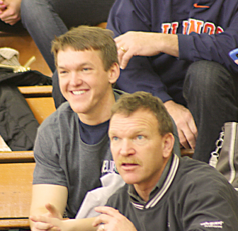 Kane Weinberg, 20, sits in the bleachers with his dad during the STLCC Lady Archers Cancer Awareness Game on Feb. 8. Weinberg was diagnosed with leukemia his senior year of high school and will continue with his chemotherapy treatment until September 2015. PHOTO | SPENCER GLEASON