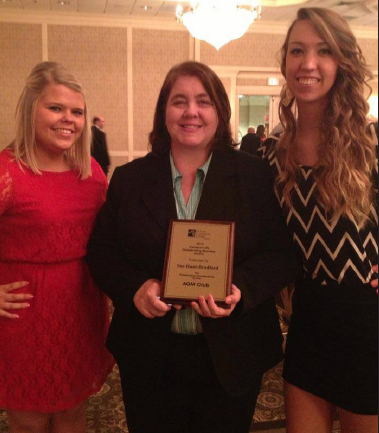 Susan Hunt-Bradford, center, displays her “Club Sponsor of the Year” Award at the May 2013 Student Award Banquet. Hunt-Bradford was presented the award by students Lindsey Jackson, left, and Jessica Tipton, right, as the sponsor of the AGM Club.