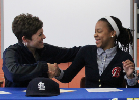 Khalia Miller shakes Ethridge’s hand after signing STLCC papers on April 9, 2014.