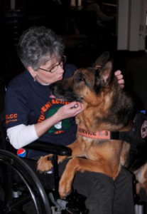 Christine Salamone pets her service dog Petey in 2010 at the Meramec campus. Salamone has written a book about service dogs as a tribute to Petey. 