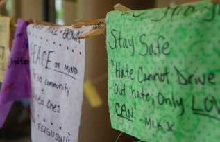 Pieces of fabric hang from a clothesline in the Student Center building with words of encouragement. The phrases were written by students for the citizens of Ferguson, Mo. The squared fabric will be pieced together to make a quilt that will be displayed on the Meramec campus as a permanent art piece. The Clothesline for Peace Project took place Oct. 6 to Oct. 9. PHOTO | KAYLA CACCIATORE